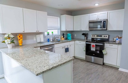 Fairburn Casa | Elegant Haven: Stylish Interiors with Serene Deck Views and Modern Comforts