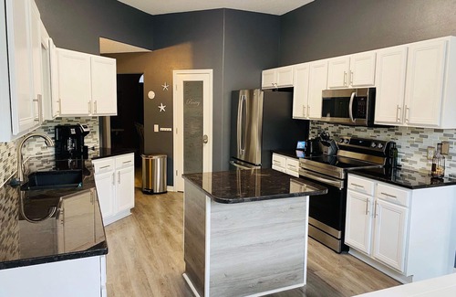 Navarre Casa | Elegant single level with 4 BR 3 BA, private oasis featuring a heated salt pool