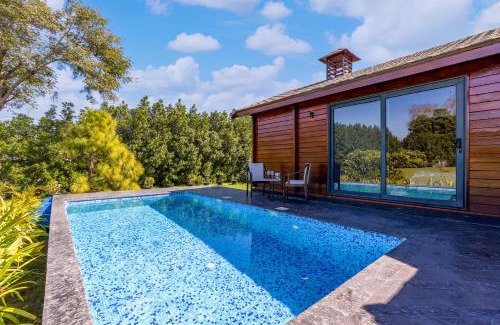 Dubbi Villa | ELIVAAS Riveira Hills - 3 BHK Wooden Cottage with Lush Garden, Pvt Pool