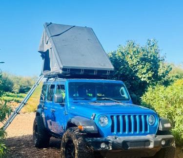 Paia Otro | Embark on a journey through Maui with Aloha Glamp's jeep and rooftop tent allows you to discover diverse campgrounds, unveiling the island's beauty from unique perspectives each day