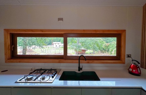 Pucon Cabaña | Enarbol Lodge, private hot tube on terrace. High-rise house among trees