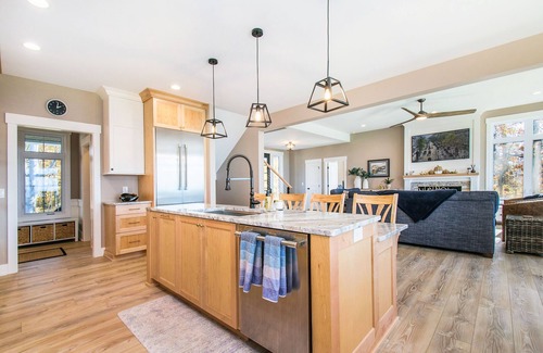 Riverside Casa | Enchanting lakefront home with pool, hot tub, firepit, game room, & washer/dryer