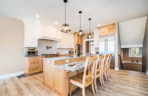 Riverside Casa | Enchanting lakefront home with pool, hot tub, firepit, game room, & washer/dryer