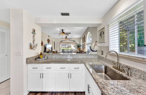 Caloosahatchee Villa | Enchanting tropical waterfront villa with boat slip, bikes, kayaks heated pool!
