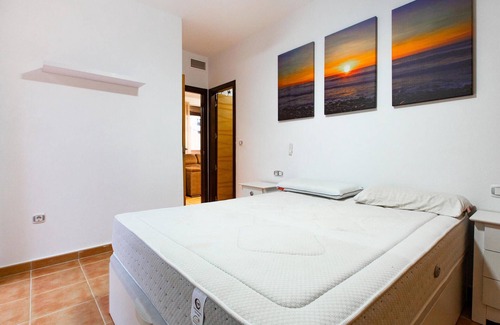 Los Geraeos Apartamento | Enjoy a relaxing vacation in this terraced house with communal pool.