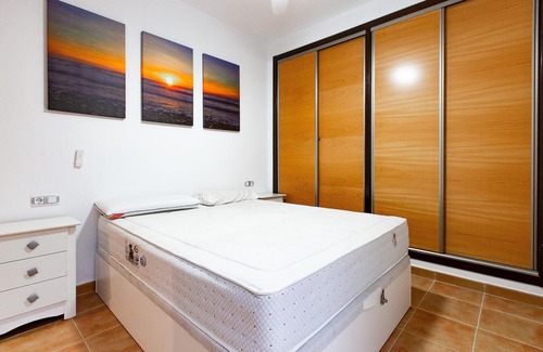 Los Geraeos Apartamento | Enjoy a relaxing vacation in this terraced house with communal pool.