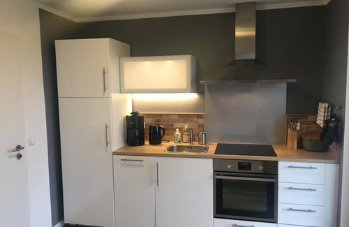 Sankt Andreasberg Apartamento | Disfruta de la fantástica vista con chimenea y terraza.
