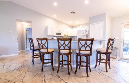 Diplomat Casa | Enjoy the Salt Life with this Heated Saltwater Pool and outdoor lanai.
