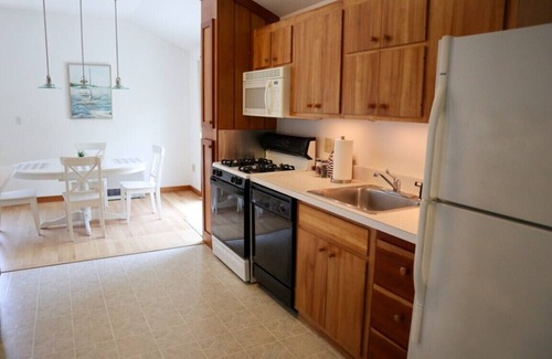 Brewster Casa | Enjoy this 1,600 sqft two story guest house with A/C, garage, balcony, and access to bike trail!