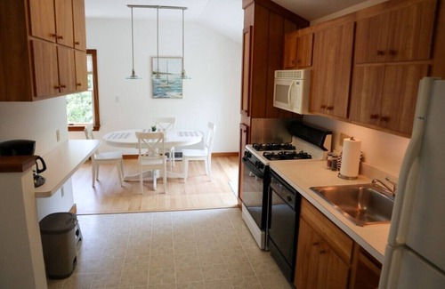 Brewster Casa | Enjoy this 1,600 sqft two story guest house with A/C, garage, balcony, and access to bike trail!