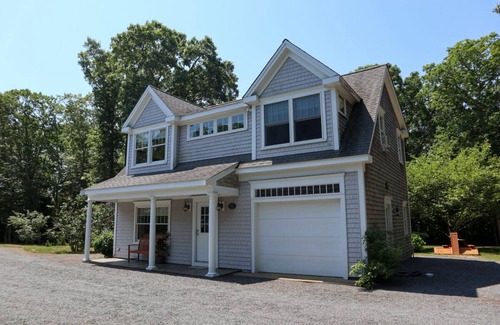Brewster Casa | Enjoy this 1,600 sqft two story guest house with A/C, garage, balcony, and access to bike trail!