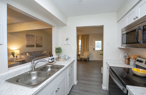 Norfolk - Virginia Beach Casa | Enticing Den with Backyard and Indoor Fireplace