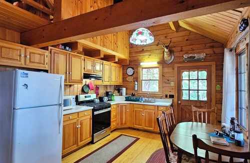 Willimantic Cabina | Escape to Howie's Camp: Unwind and Recharge at This Lakefront Log Cabin