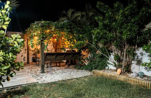 Bucana Casa | Expansive Paradise with Private Jacuzzi and Tropical Patio