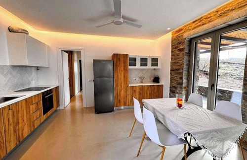 Pisses Apartamento | Experience Authentic Charm at Tzia Stone Apt with a Modern Twist and Sea Views