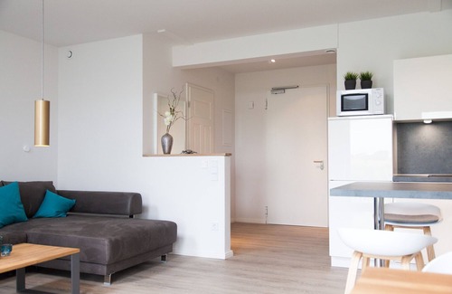 Dornum Apartamento | "Experience unforgettable vacation days in nature at Gulfhof Polder72!"