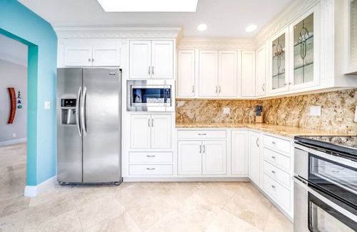 Cypress Lakes Casa | EXQUISITE HEATED POOL+WATERFRONT! 1 MILE TO BEACH!