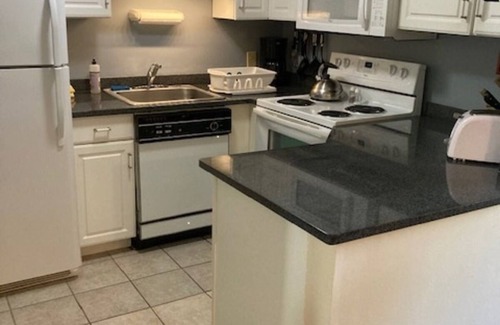 Weirs Beach Condominio | Family condo in the center for all season fun.