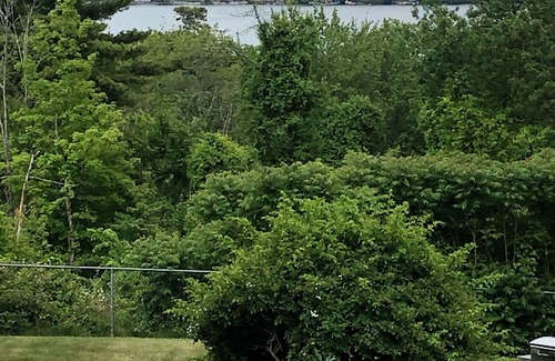Weirs Beach Condominio | Family condo in the center for all season fun.