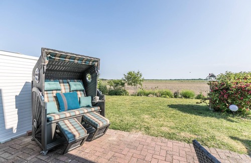 Westerdeichstrich Apartamento | "Favorite place": Modern, rural vacation apartment with a beautiful terrace