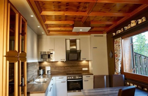 Schwarzenbach Casa | Ferienhaus 09-e mit Kachelofen - Ferienhäuser im Feriendorf Weissensee im Allgäu
