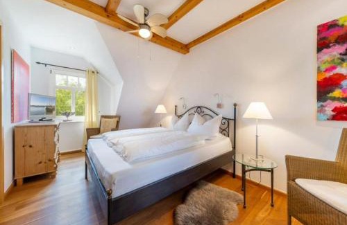 Zudar Casa | Ferienhaus Rügenbrise mit Seeblick direkt am Wasser
