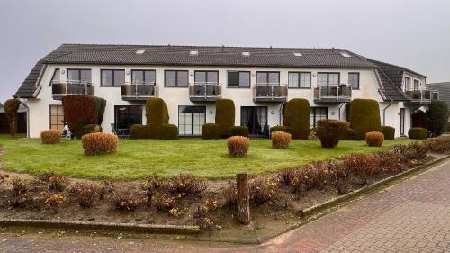 Dorumer Neufeld Apartamento | Ferienwohnung am Kormoranweg