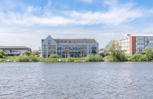 Norderhafen Apartamento | Ferienwohnung "Halligstork" direkt am Nordseedeich mit Blick auf den See