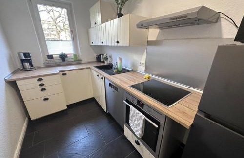 Sudstadt Apartamento | Ferienwohnung NORDLICHT mit Balkon und Smart-TV