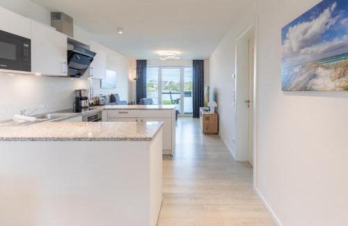 Norderhafen Apartamento | Ferienwohnung Nordseetraum direkt am Nordseedeich mit Blick auf den See