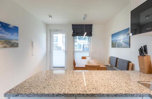 Norderhafen Apartamento | Ferienwohnung Nordseetraum direkt am Nordseedeich mit Blick auf den See