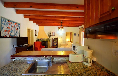 Llubi Casa | Finca S'estable is a cozy family vacation home with a swimming pool.