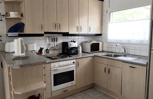 El Mas Fumats Apartamento | Apartamento en villa con piscina.