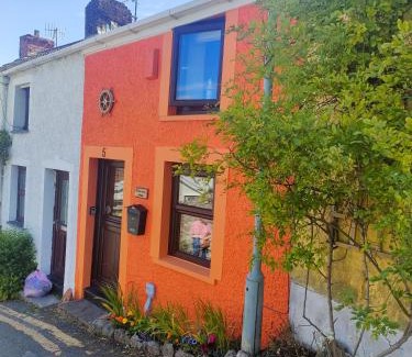 Mumbles Casa | Fishermen's cottage with log burner, 2 bathrooms & sea views from garden terraces