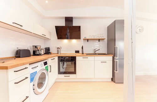 Wenningstedt-Braderup Apartamento | Fließende Übergänge, Freigelegtes Mauerwerk, ein Mix aus Weiß und Grau Gepaart m