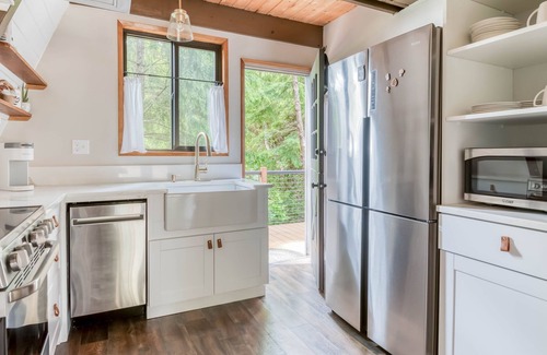 South Beach Casa | Fully Remodeled, Modern A-Frame Gem with Hot Tub, Deck, and Fire Pit!