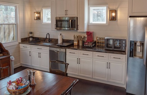 Cleveland Park Casa | Fully renovated 1800s Carriage House seamlessly blends history w/modern luxury.