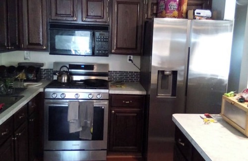 Southfield Casa | Fun House 2 with a Pool table on main floor game room with walk out patio door.