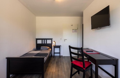 Schortens Apartamento | Gästehaus Olympia Wilhelmshaven - Moderne Einzelzimmer mit eigenem Bad für Monteure