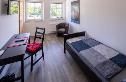 Schortens Apartamento | Gästehaus Olympia Wilhelmshaven - Moderne Einzelzimmer mit eigenem Bad für Monteure
