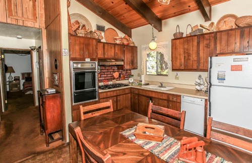 Summit Estates Casa | Gallagher's West - Pine surrounded deck and barbecue! Bumper Pool and Wet bar! Darts!
