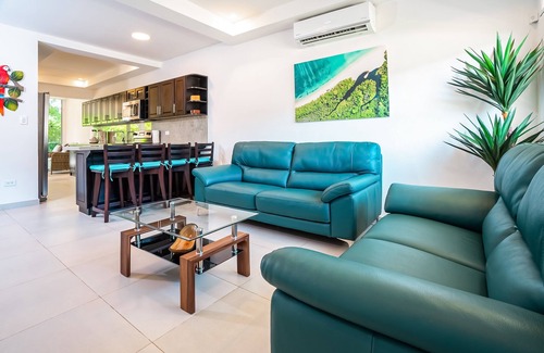 Villarreal Condominio | Gated resort condo with on-site pool, outdoor areas, private patio, & W/D