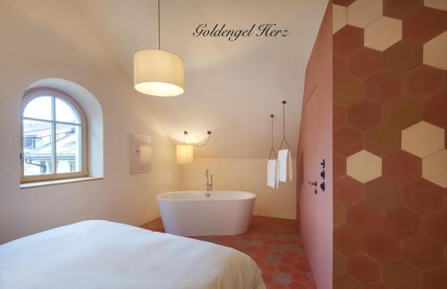 Caldaro Sulla Strada del Vino Apartamento | Goldengel Design - Suiten im historischen Ortskern von Kaltern