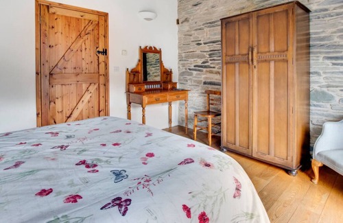 Whitland Casa | Este granero convertido ofrece vistas panorámicas a lo largo de la gloriosa campiña del oeste de Gales y hasta