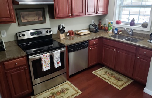 Laconia Condominio | Precioso condominio en el lago Winnipesaukee con excelentes vistas de la bahía de Paugus