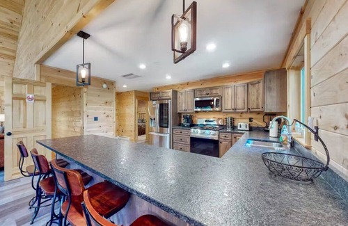 Carrabassett Valley Cabina | Gorgeous dog-friendly cabin with great view, deck, hot tub, & gas fireplace