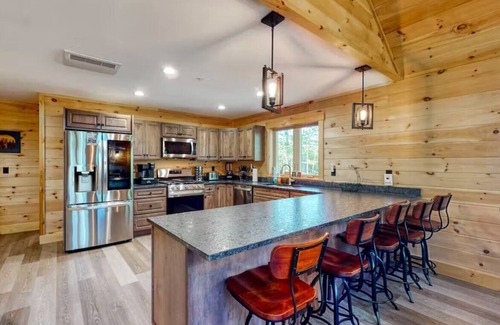 Carrabassett Valley Cabina | Gorgeous dog-friendly cabin with great view, deck, hot tub, & gas fireplace