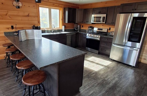 Carrabassett Valley Cabina | Gorgeous dog-friendly cabin with great view, deck, hot tub, & gas fireplace
