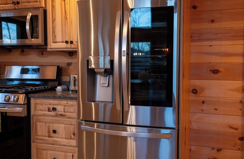 Carrabassett Valley Cabina | Gorgeous dog-friendly cabin with great view, deck, hot tub, & gas fireplace