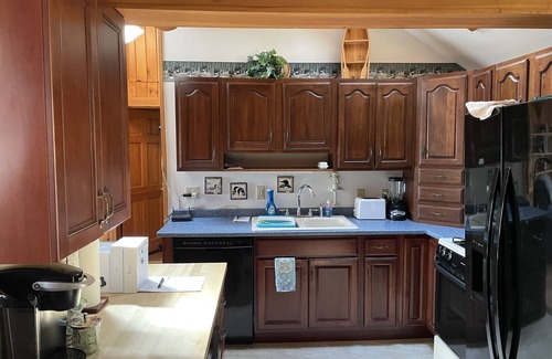Dedham Casa | Gorgeous Lakefront House Rental facing South on Green Lake in Dedham, Maine